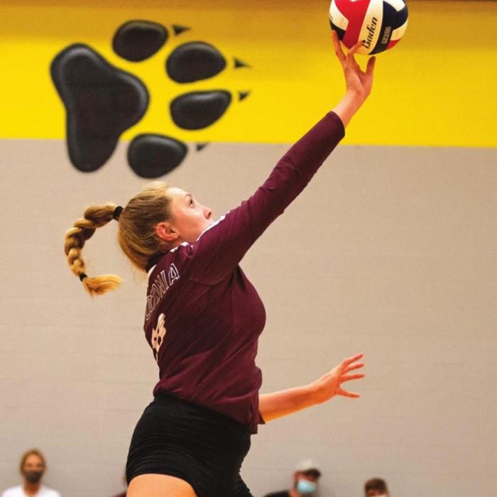 Carly Siptak guides the ball back over the net for the Flatonia Lady Bulldogs in last Friday’s match. Flatonia has won three of its last four matches. Photo by Stephanie Steinhauser