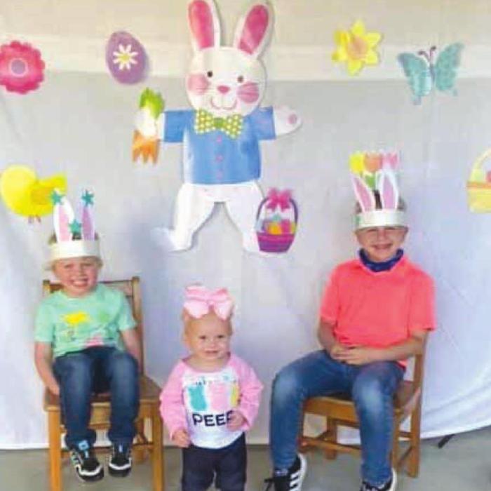 Simon, Savannah, and Seth Seydler pose for an Easter picture.