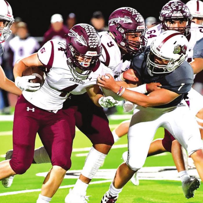 Flatonia defensive players Angel Netro #16, Dayton Cliffe #7 and Gabriel Venegas #44 stop this Ganado ball carrier in Friday night’s district game in Flatonia. Photo by Stephanie Steinhauser