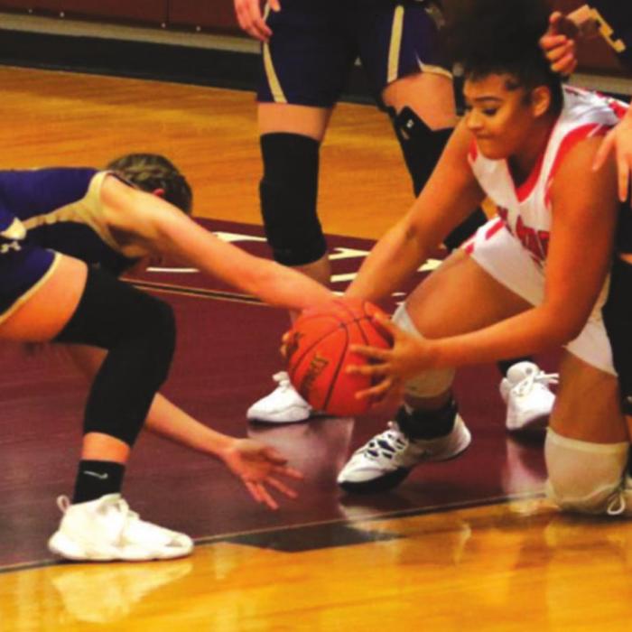 Schulenburg’s Airyanna Rodriguez fights for a loose ball with a Shiner player during Friday’s district tiebreaker game in Flatonia. Shiner won 60-56 to grab the runner-up playoff spot and so the Schulenburg Lady Horns head to the playoffs as the No. 3 seed out of District 28-2A. Photo by Audrey Kristynik