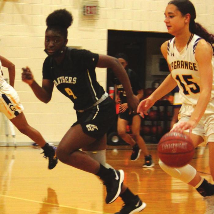 La Grange’s Camille Gonzalez, right, and Tori Harold, left, lead a La Grange fast break Tuesday. Photo by Jeff Wick