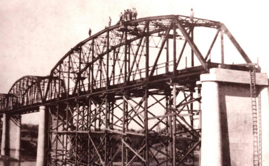 The custom-designed Parker through truss bridge with five spans, which crosses the Colorado River on business Highway 71, was completed in 1941 and is on the National Register of Historic Places. This photo shows the bridge, still under construction, as it may have looked around the time Junell (Schroeder) Van Horn’s pregnant mother climbed a ladder up to the bridge to get to the hospital.