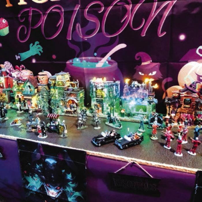 This miniature village features a row of spooky taverns