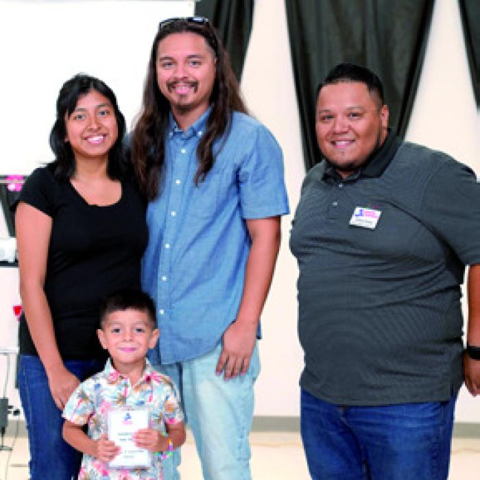 Above, the 2025 Family of the Year Recipients: (from left) Jennifer Garza; Elijah Garza; Joe Garza; and Josue Rivas, PAT Development Director.