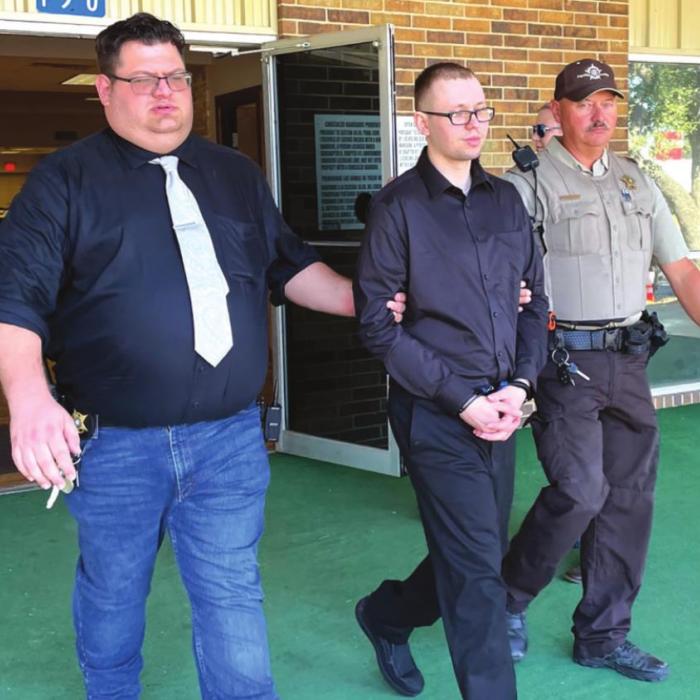 Fayette County Sheriff’s Deputies escort Dylan David Nelson out of the Knights of Columbus Hall in La Grange Friday after his the conclusion of his murder trial. The trial was held at the hall instead of the courthouse for social distancing purposes. Photo by Andy Behlen