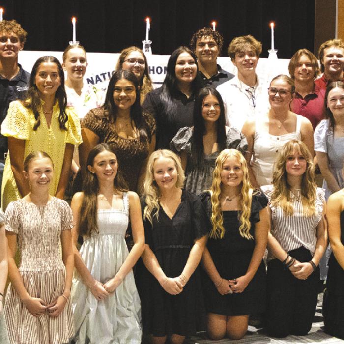 Monday’s new National Honor Society inductees join returning members for a group photo Monday. Photo courtesy of Lucy Carr