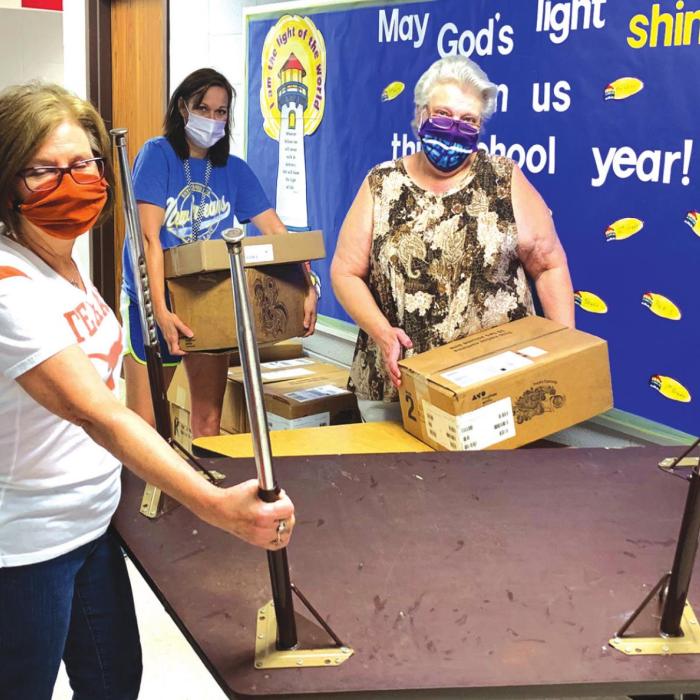 Staff members at Sacred Heart School in La Grange were masked-up and very busy last week as they were getting the campus prepared for the return of students Aug. 13.