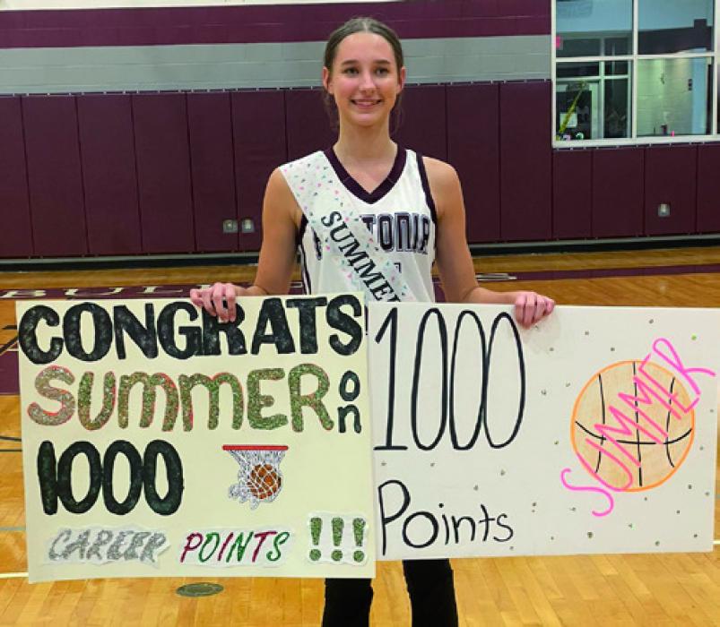Summer Sodek poses with her team, left and individually, right, after Tuesday’s victory over Louise in which she scored her 1,000 career point. Sodek is just a sophomore.