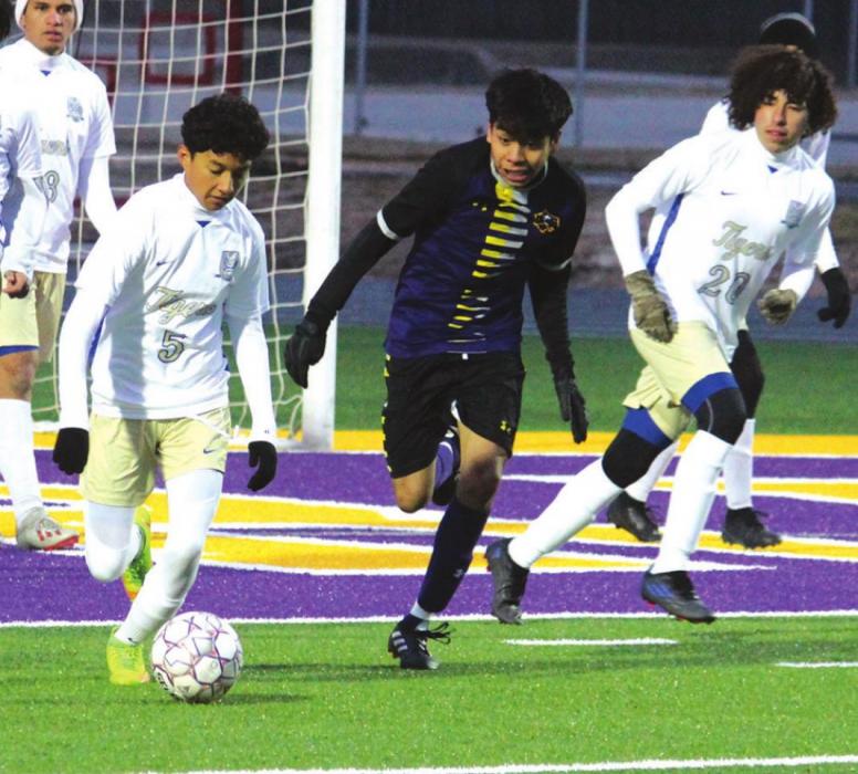 La Grange’s Angel Vasquez gives chase on a very cold night at Leopard Stadium Friday against Rockdale. Photo by Jeff Wick
