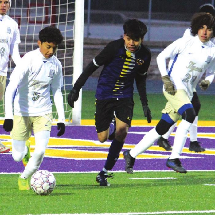 La Grange’s Angel Vasquez gives chase on a very cold night at Leopard Stadium Friday against Rockdale. Photo by Jeff Wick
