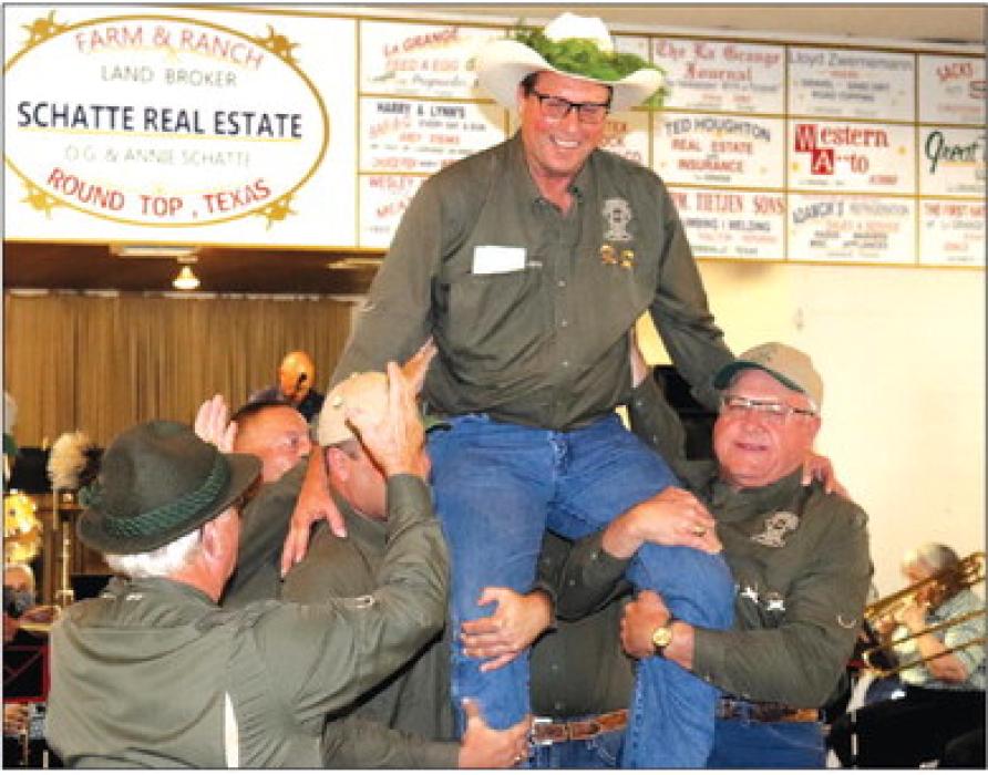 Eddie Marburger is hoisted up on the shoulders of fellow Round Top Rifle Club members after winning the 151st Schützenfest on Sunday. Photo by Gary E. McKee/Texas Polka News