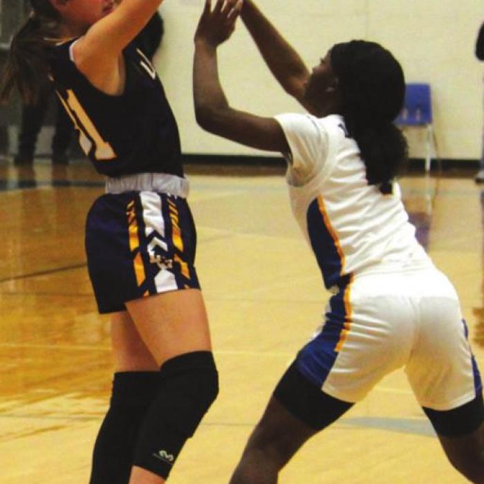 La Grange’s Keslyn Davis with a La Vega defender covering her Thursday. Photos by Jeff Wick