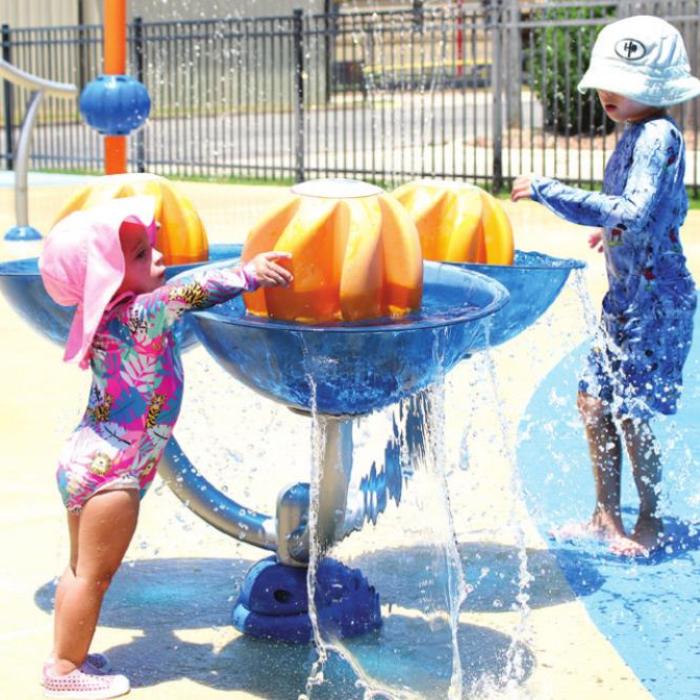 Hudson and Hadley Mercer play at the La Grange Spash Pad on Saturday. Photos by MaKenzie Givan