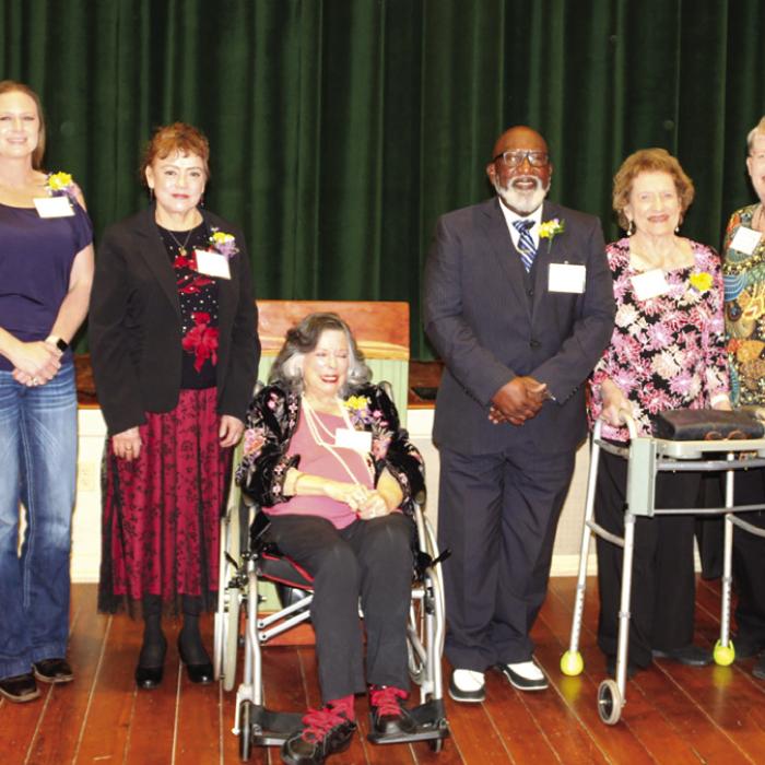 The honorees at Sunday’s “Women Making History Event,” from left to right: Teresa Stanley Brown, Angela Lala, Maria Vega, Karey Patterson Bresenhan, Rev. Andrew Stafford (accepting on behalf of his late mother Maezell Thomas Stafford Townsend), Lucille Ann Blume Strickland, Brenda Lincke Fisseler, and Robin Wedgeworth (accepting on behalf of her late mother Gladys Giese). Photo by Jessica Montez