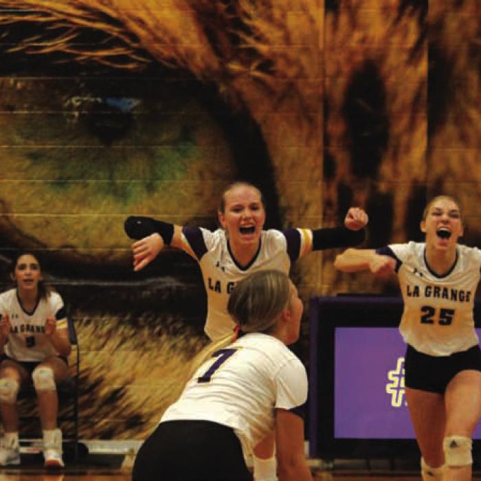 The members of the La Grange volleyball team celebrate after scoring a point in Friday’s match. Photos by Jeff Wick