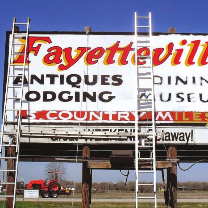 Years ago, Homer Allen painted the well-known Fayetteville sign on Highway 71.