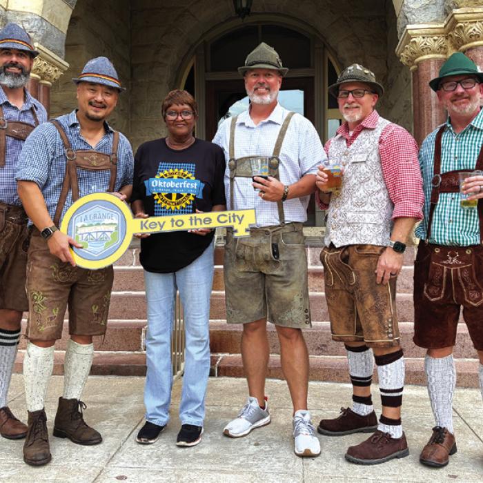 Mayor Jan Dockery presented the key to the city a group of friends who regularly return to La Grange for the annual Oktoberfest, which was held Saturday in downtown La Grange. The buddies said they already have it on their calendar for next year. Pictured here are Patrick Jumper, Matt An, Mayor Dockery, Josh Orr, Chuck Grear, and Jeff Ketzle. Photo by Regina Keilers