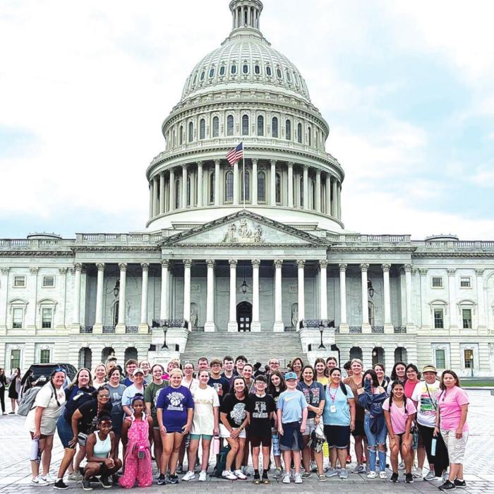 Local students and their chaperones in front of the US Capitol building.