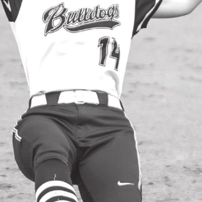 Katherine Bruns slides safely into third base in Tuesday night’s district game in Flatonia.