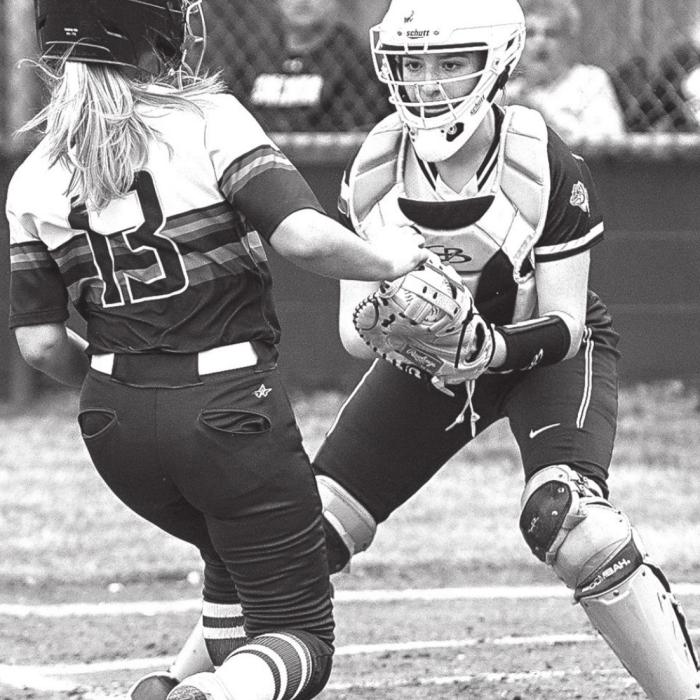 Laurel Betak stops a Lady Comanche before crossing the plate to get the out for Flatonia. Photos by Stephanie Steinhauser