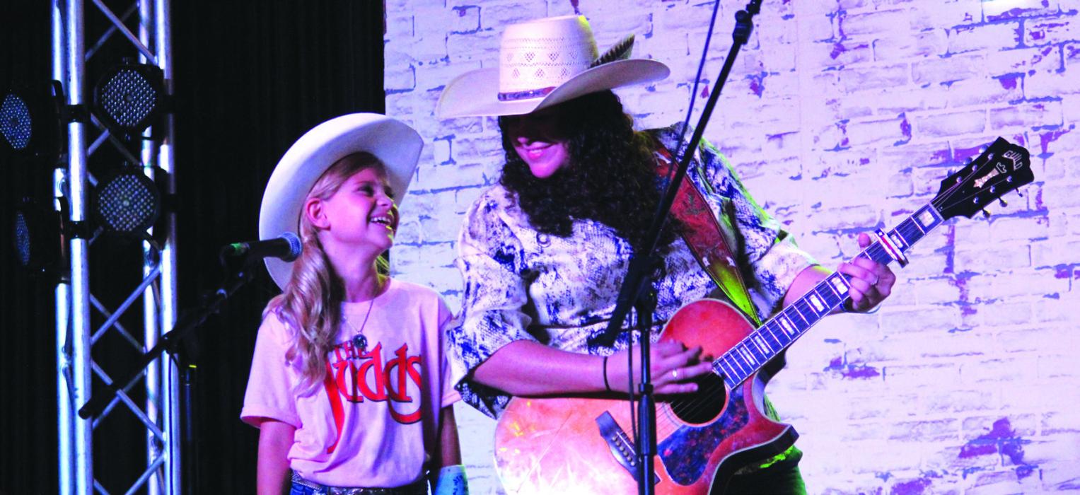 While this year’s Fayette County Fair had musical headliners from all over the country, one of the loudest crowds of the four day fair was for a pair of local performers, Marley Jane Vasek, left, and Briana Adams, who sang several songs during Thursday’s Queen’s contest. Photo by Jeff Wick