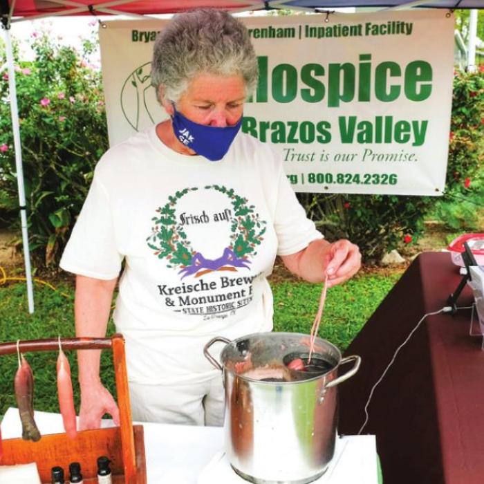 Bobbie Nash of the Fayette County Historical Commission demonstrated traditional candle-making.