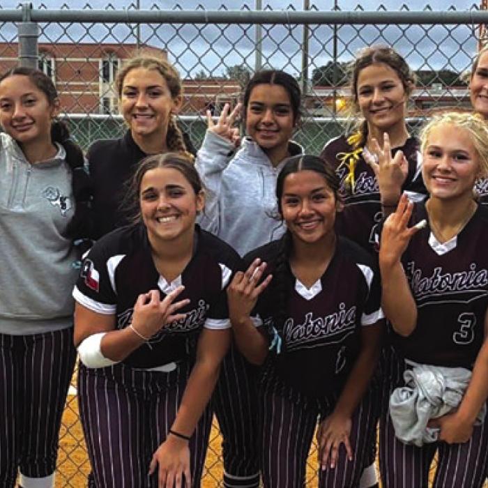 The members of the Flatonia softball team celebrate their Area series-clinching victory Friday in Beeville.