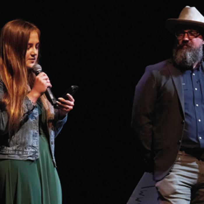 Student director Layelah Martin addresses the crowd before Friday’s show, along with her father Will Martin, the show’s adult mentor.