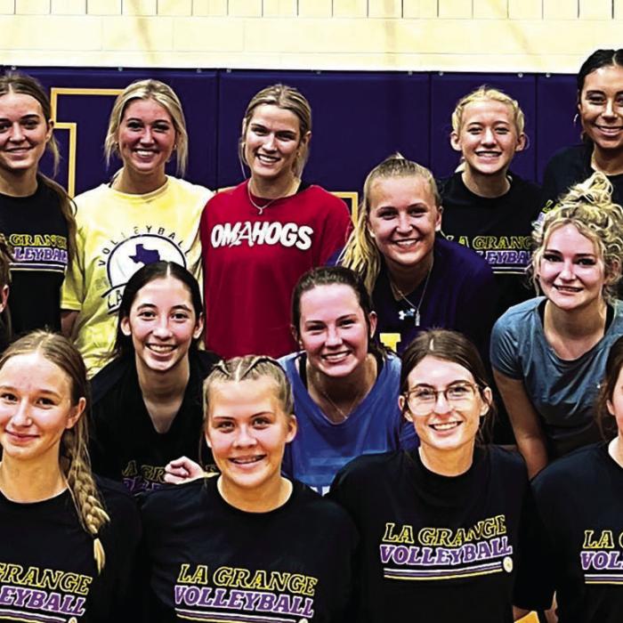 For the first time in the last three years, the La Grange volleyball team held an alumni game. Shown here are the varsity team members and the alumni members posing for a photo after Saturday’s match.