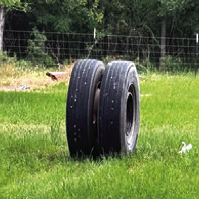the damage to the Rek Hill house and the rogue tire.