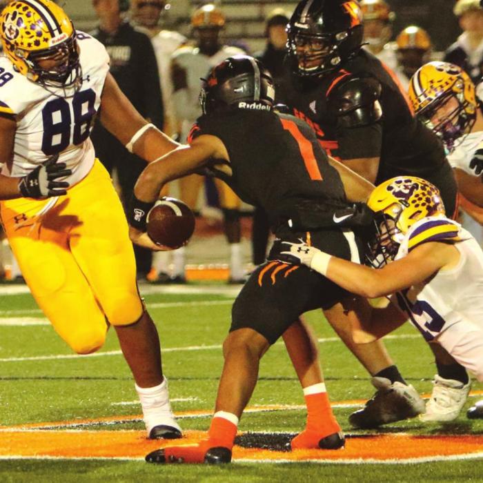 Above: La Grange’s Kadyn Hall drags down Smithville quarterback Derrick Roberson as Jaren Woods comes to help out. Right: La Granges Jakobe Wilkerson pursues Smithville’s Tyson Hancock. Photos by Darrell D. Gest