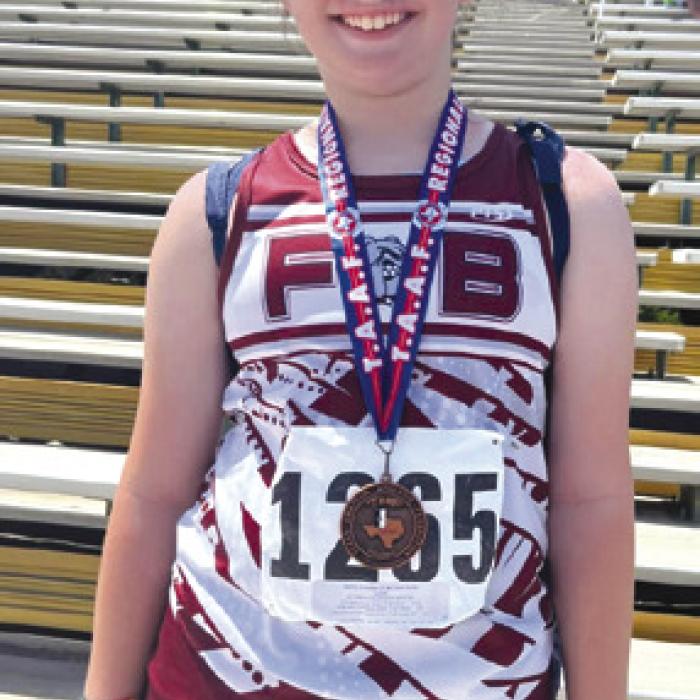 Caroline Cherry and her metal from the track meet.
