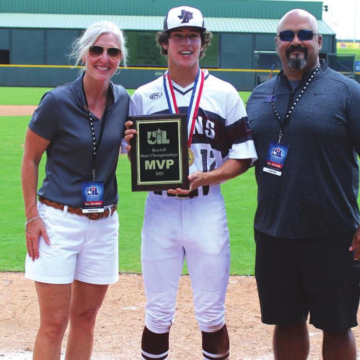 Fayetteville freshman pitcher Keagan Supak is presented the championship MVP award after the game Thursday. Supak pitched into the seventh inning, allowing six hits three runs and striking out six. He also drove in a run in the title game. Photo by Jeff Wick