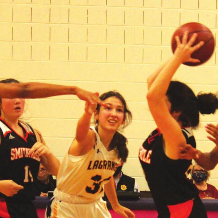 The La Grange defense, in this photo Ariel Thompson, Keslyn Davis and Aysia Grant, didn’t give Smithville any time to relax Friday. Photo by Jeff Wick