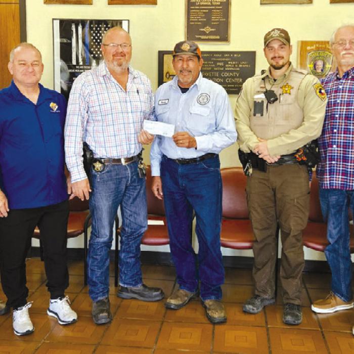 The Knights of Columbus Council No. 2574 presented a $500 check to the Deputy Santa Program. Pictured from left is: Investigator Marc Bennet, Marcus Recek (KC Financial Secretary), Lt. David Beyer, Hector Cervantez (Grand Knight), Deputy Jared Michalec, Garry Schellberg (Treasurer), and Sgt. Angela Lala.