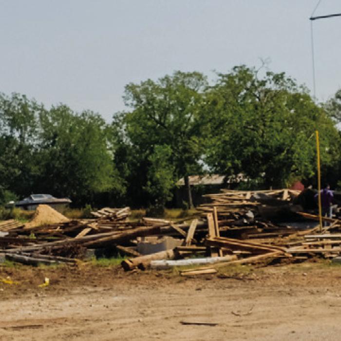 Workers have been cleaning up the old La Grange Livestock Auction property on Business 71 west of the Colorado River this week. Flatonia Livestock Commission owns the property and will continue receiving cattle for sale there on Sundays and Monday mornings. Photo by Andy Behlen