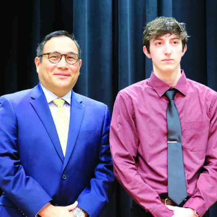 Drew Harbers (right) plans to study cyber security at Texas State Technical College. His parents are Brad and Cindy Harbers. He picked Rusty Cauthern as his favorite teacher. Cauthern was ill on the day of the banquet; La Grange High School Principal John Pineda (left) stood in for Cauthern at the event.