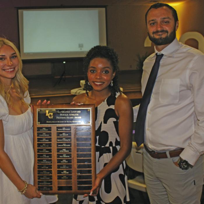 The La Grange High School Female Fighting Heart Award winners presented at last Monday’s Sports Banquet were, left, Kylie Trlicek and center, Diamond McKenzie, presented by head coach Ryan O’Neal. Reprinting to correct a mistake from Friday’s Edition