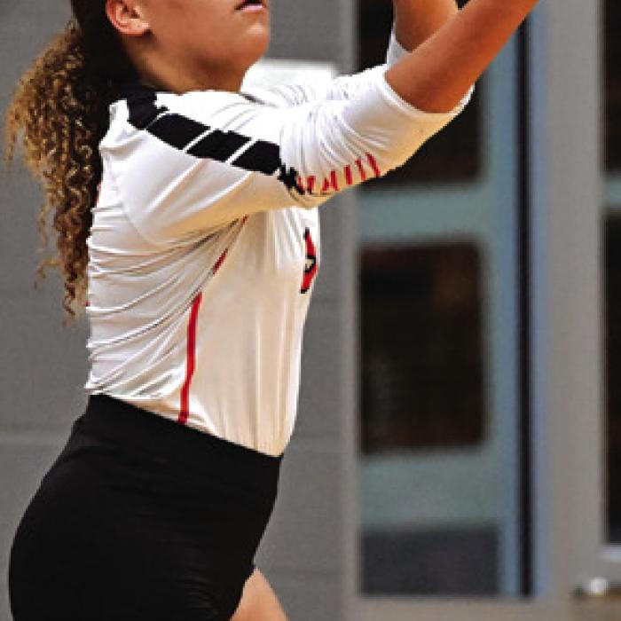 Schulenburg’s Kieryn Adams readies to serve the ball.