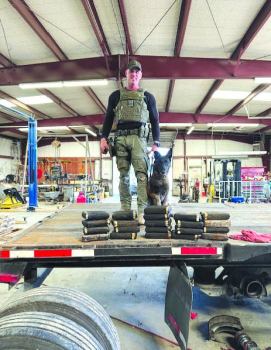 Sgt. Randy Thumann and partner K9 Kolt discovered 23 kilos of cocaine with a street value of $2.3 million dollars from the altered trailer axles.