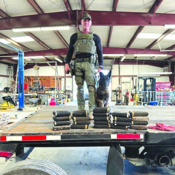 Sgt. Randy Thumann and partner K9 Kolt discovered 23 kilos of cocaine with a street value of $2.3 million dollars from the altered trailer axles.