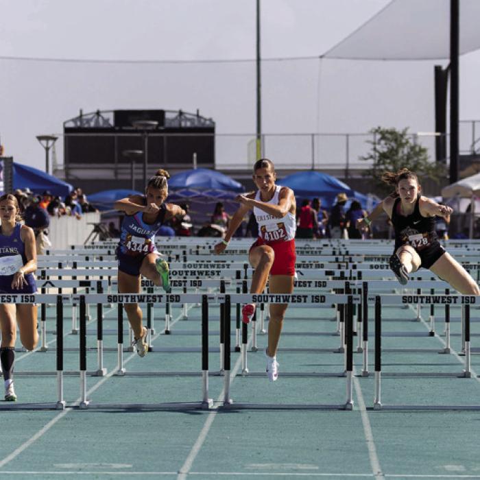 Macie Collier, in the red shorts, center.
