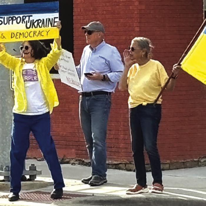 Supporters take stand for Ukraine. From left to right: Kathleen McShane, Matt Holdeman, and Rebecca Hegar.