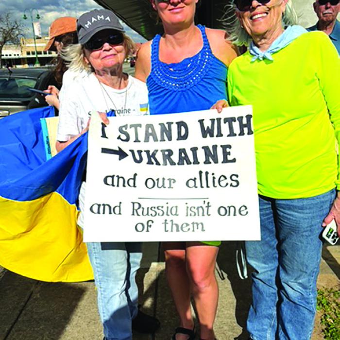 Americans for Democracy are meeting 3-4 p.m. on Sundays on SW corner of La Grange Square. (Left to Right) Virginia Leech, Ukrainian Olga Beishir, and Ginger Heath.