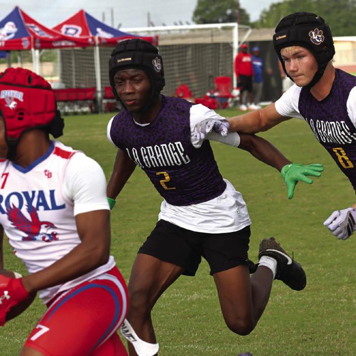 La Grange’s Skip Holmes, center, and Klayton Michalka, right, chase down this Brookshire Royal receiver Friday. Photo by Darrell D. Gest