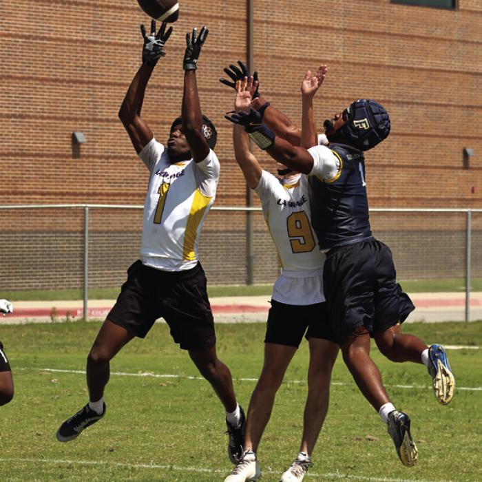 La Grange’s Traiton Broussard leaps in front of this Freeman receiver to make an interception Friday. Photo by Darrell D. Gest
