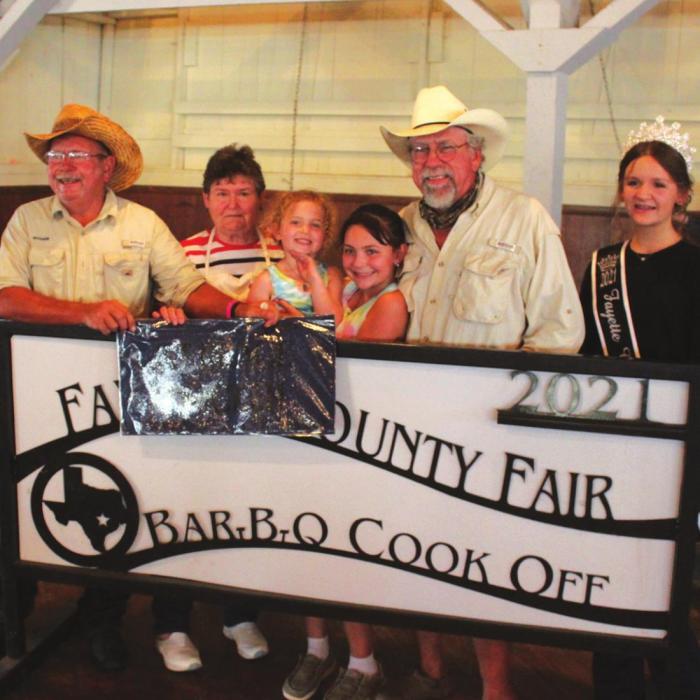 The Champion Chicken at this year’s Fayette County Fair was made by the Twisted System team of La Grange, including Roger Brandt, Marty Brandt and Janice Brandt. Also shown is Fayette County Fair Queen Charlee Wessels. Photos by Jeff Wick