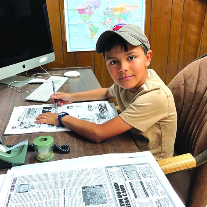 After catching an error in a recent edition of the The Fayette County Record, 10-year-old La Grange homeschooler Lou McCain volunteered his services as a proofreader for this edition of the newspaper. Shown here is Lou at a desk at the newspaper office correcting pages Wednesday afternoon. We think you will agree that this may be the cleanest edition of The Record yet. Thanks Lou! And you are welcome back anytime.