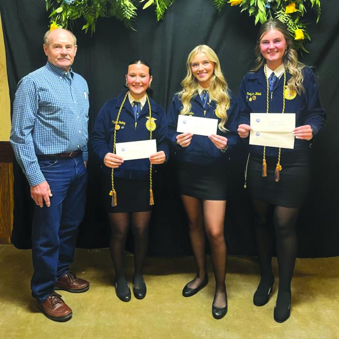 Schulenburg Young Farmers President Mark Vecera (left) presented three recipients with scholarships at the Schulenburg FFA banquet that was held on Thursday, May 8. Claire Oeding (second from left) and Olivia Mathis (second from right) received $1,500 each. Madyson Holub (right) received a $1,500 and $500 scholarship from Area XI Young Farmers, Schulenburg Chapter.