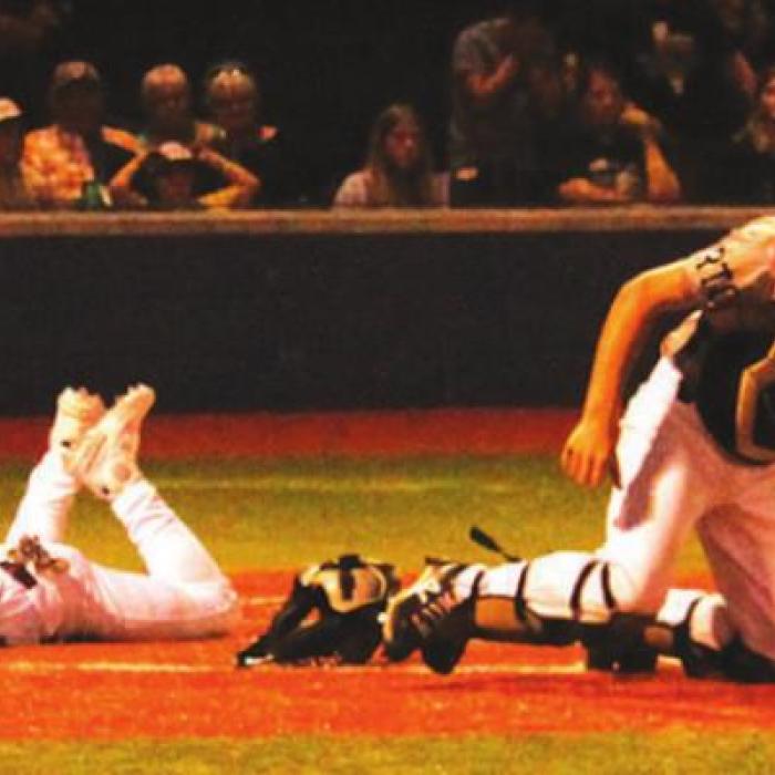 Fayetteville’s Travis Gully slides home with what would be the game-winning run Thursday. Photos by Jeff Wick